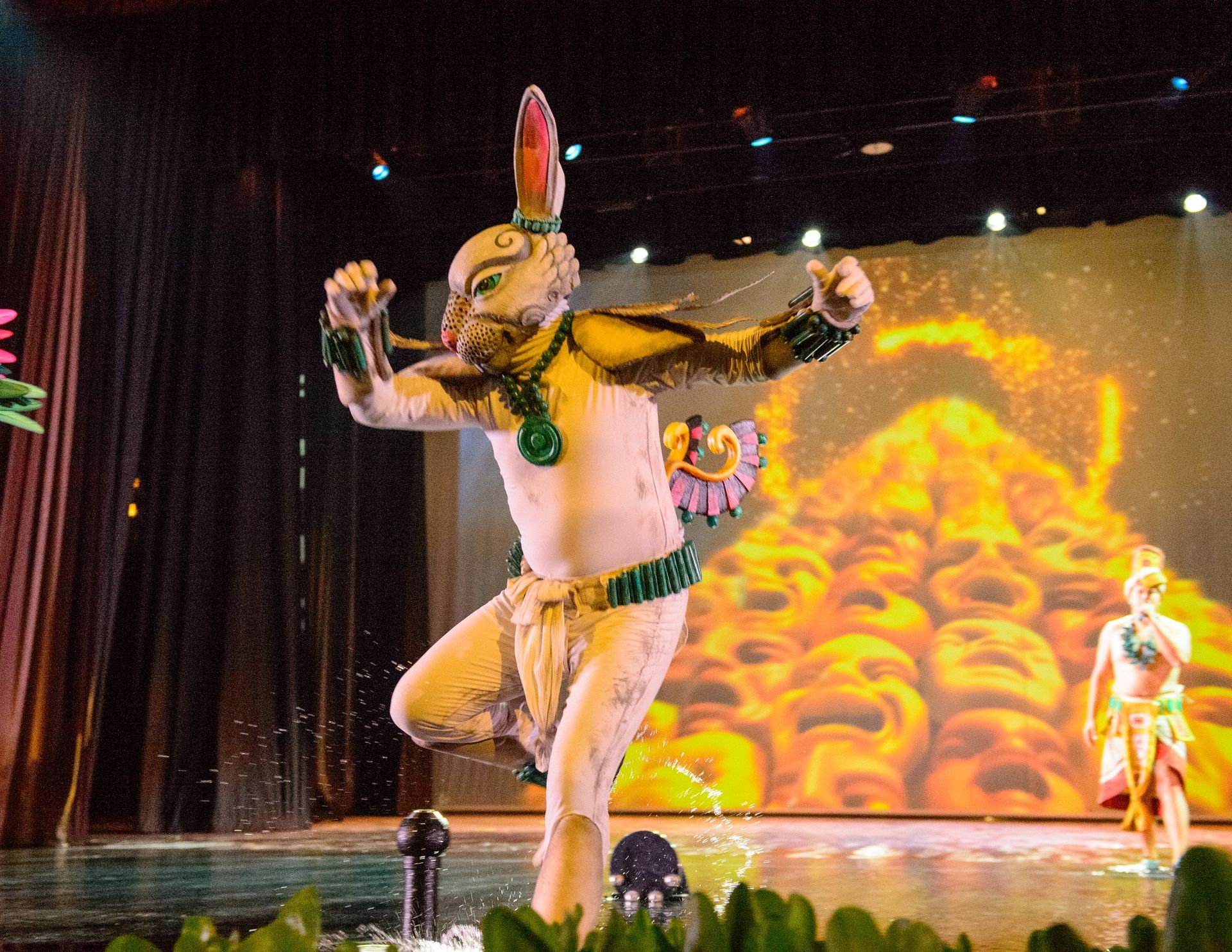 A man in a rabbit costume is dancing on a stage