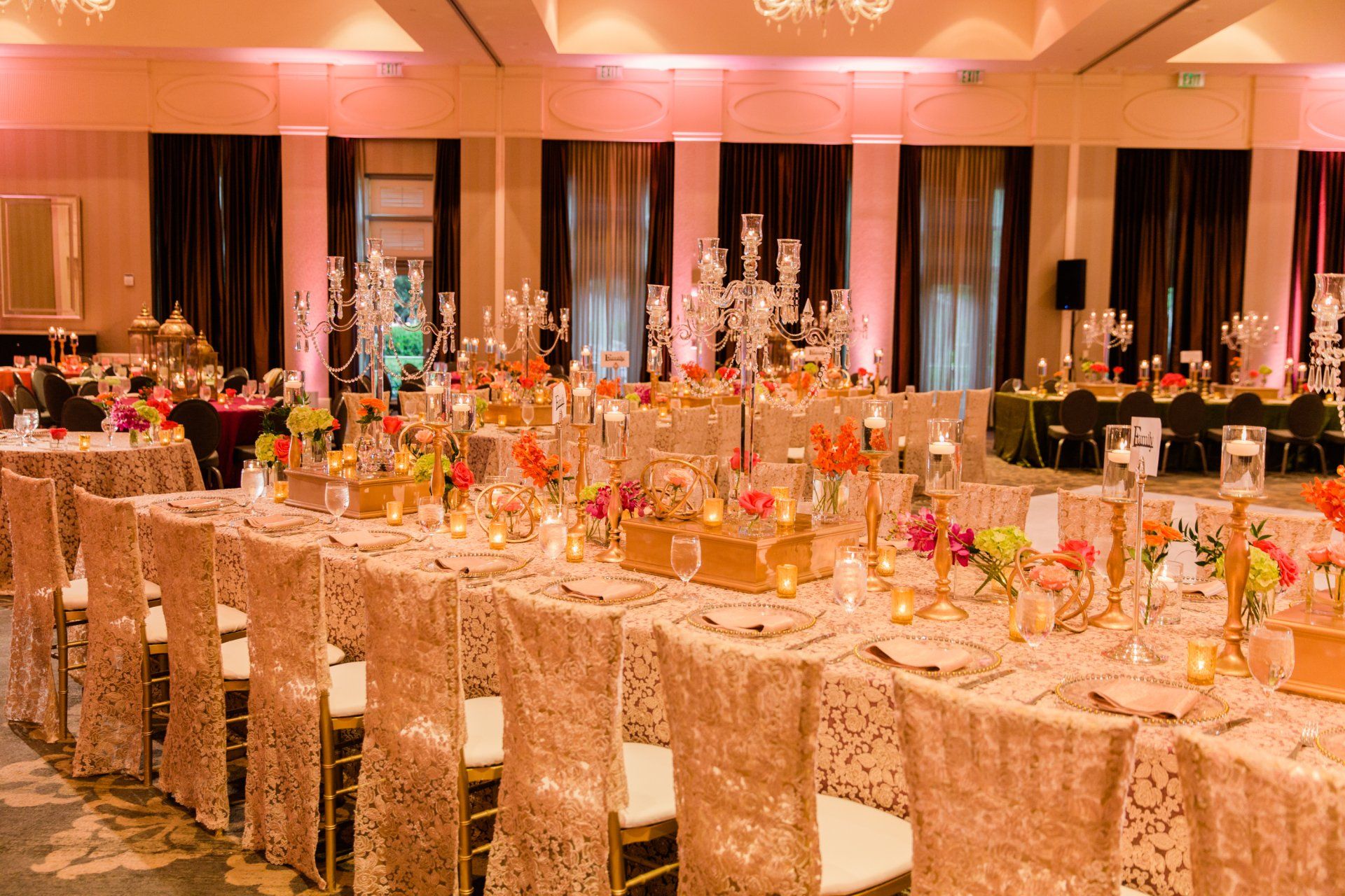 A long table and chairs are set up for a wedding reception.