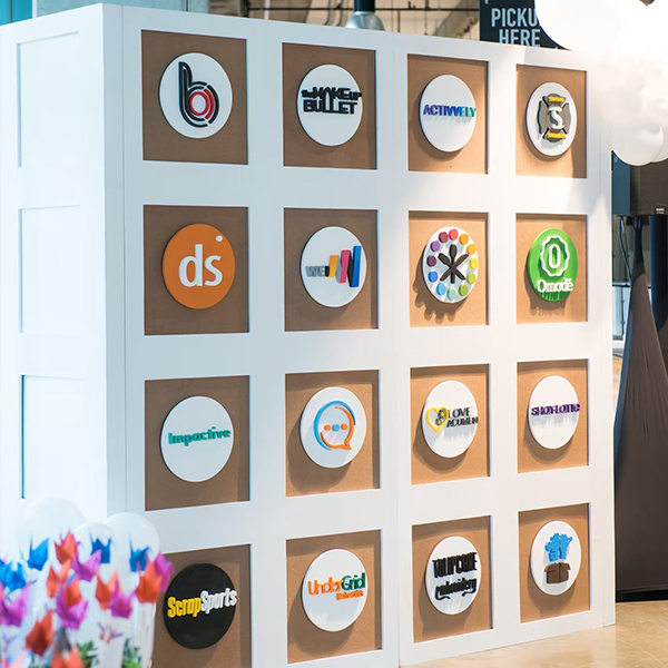A wall with many logos on it including one that says ds