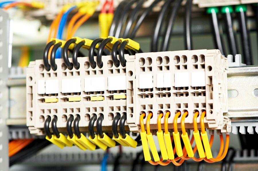A bunch of wires are connected to a electrical box.