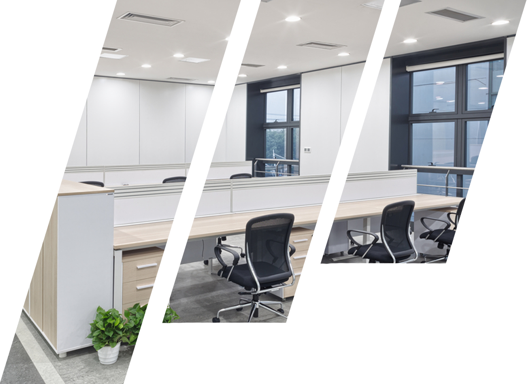 A modern office with a lot of windows and desks and chairs.