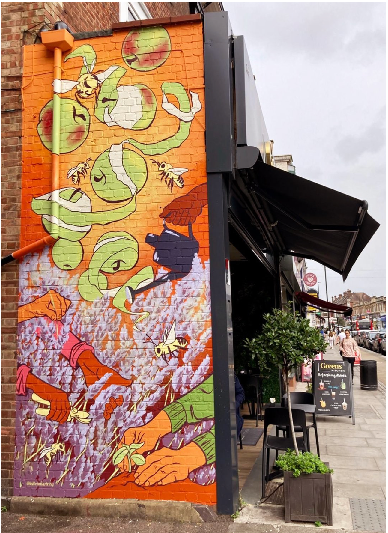 A colorful mural on the side of a building