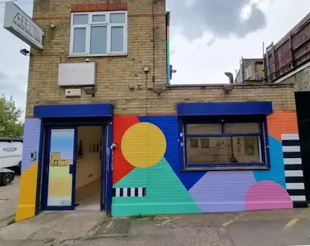 A building with a colorful mural on the side of it