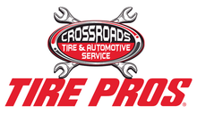 Crossroads Tire & Automotive Service Tire Pros logo with crossed wrenches in red, white, and gray