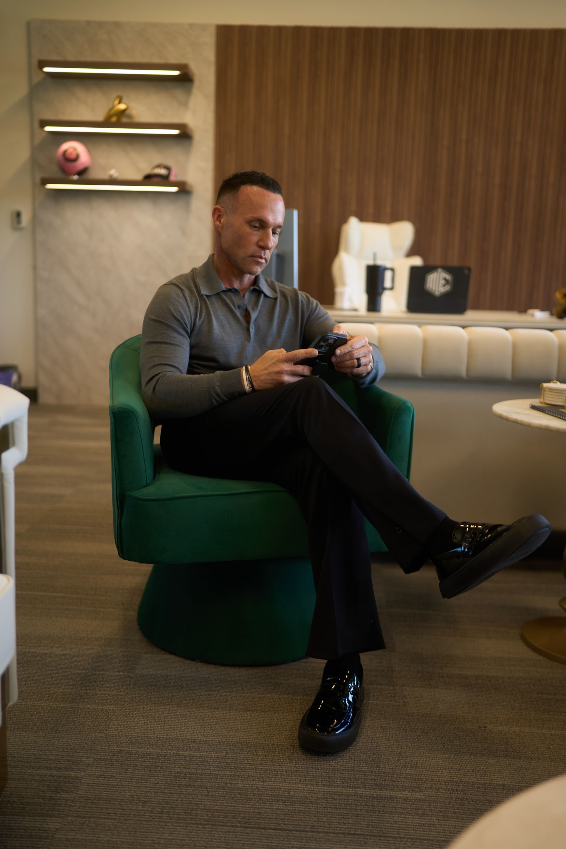 Marc Effron reading on his phone at his desk in his office