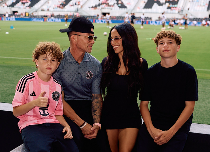 Marc Effron and his family on the sidelines at a professional soccer match