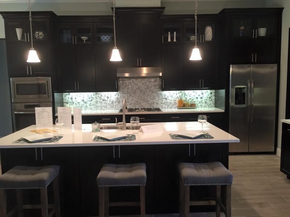 White granite countertop in dark kitchen