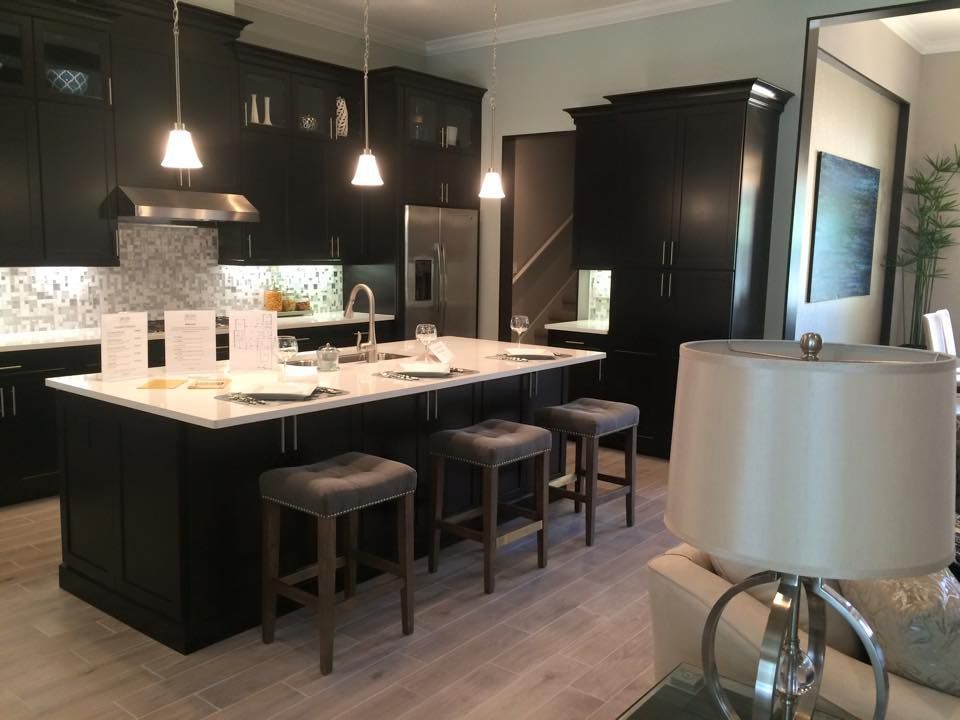 White granite countertop with dark cabinets