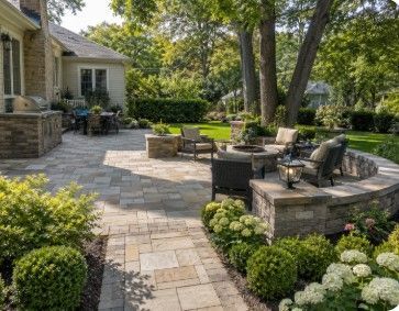 Residential landscape design with a curved paver walkway, structured planting beds and a mature Evanston Illinois home Residential landscape design with a curved paver walkway, structured planting beds and a mature Evanston Illinois home