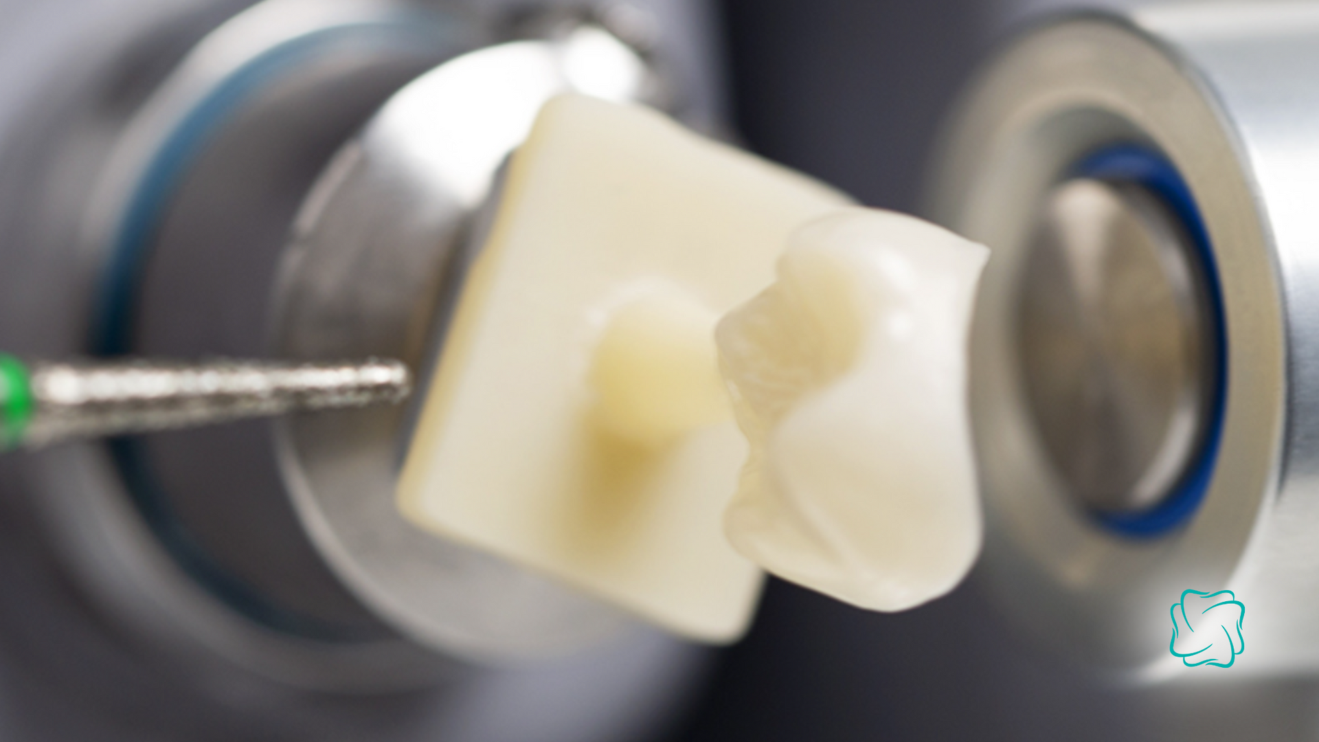 Dental crown being milled by a machine; ceramic block and drill bit are visible.