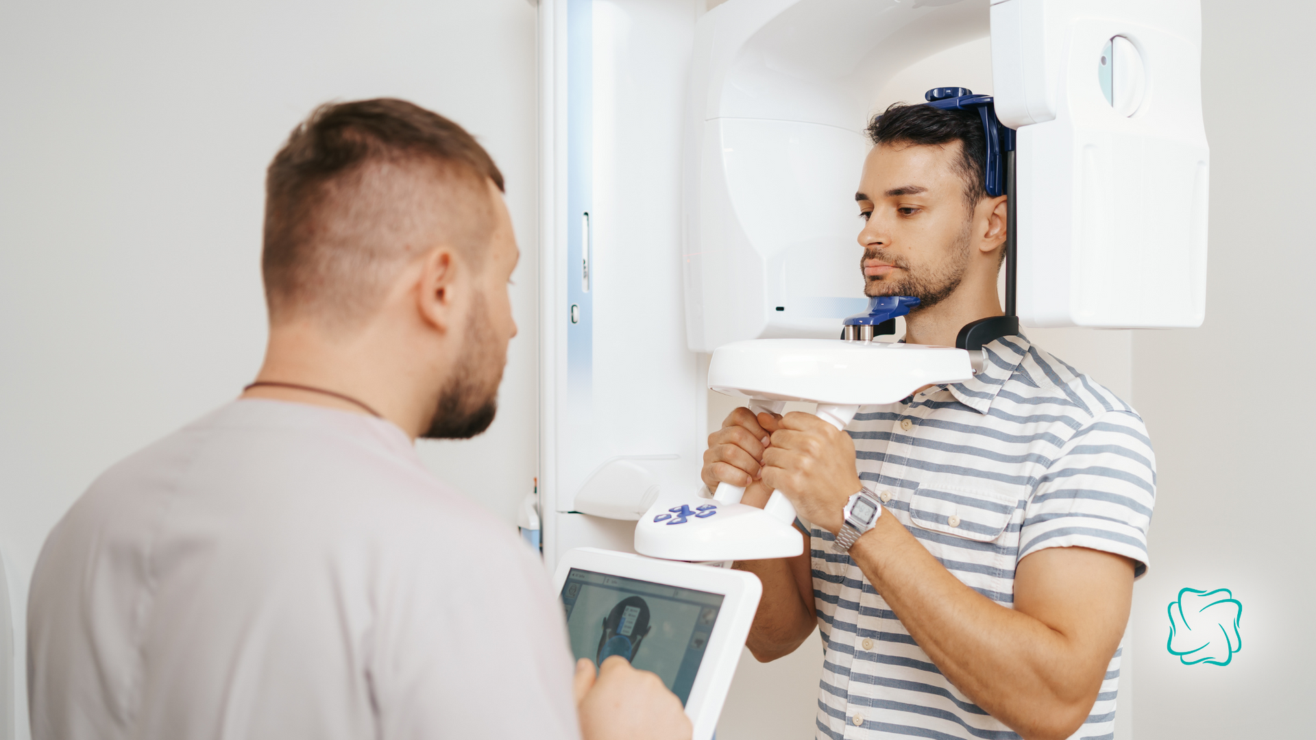 Man in dental scan, dentist adjusting machine. Clinic setting, white equipment.