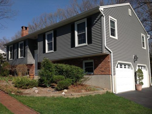 A large house with a white garage door