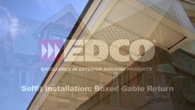 Close-up of a house's boxed gable return soffit installation. Text