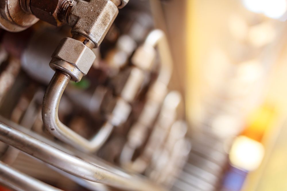 A Close Up of a Metal Pipe on a Machine — Subat Plumbing Services in Kurri Kurri, NSW