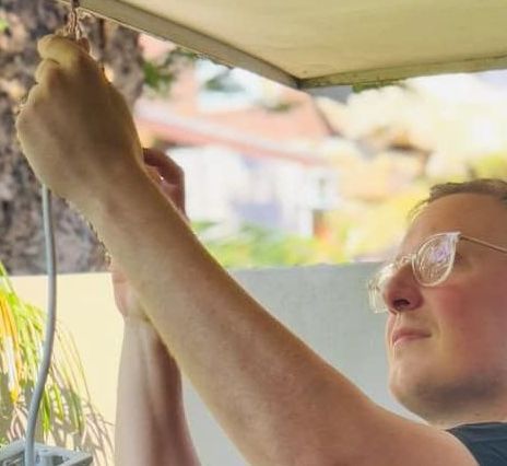 Man fixing light
