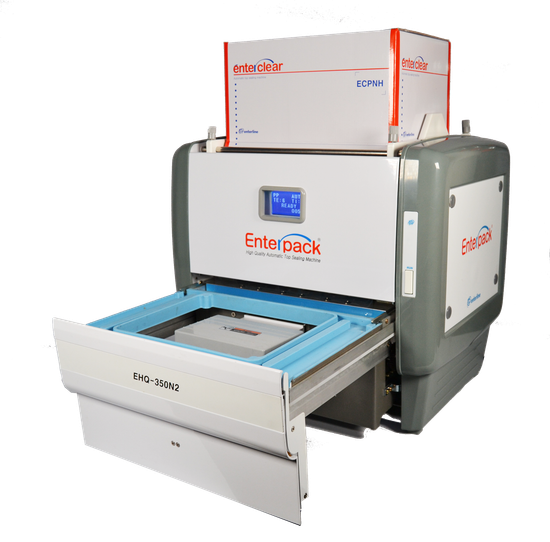 An Enterpack tray sealer machine with an open sliding tray, featuring white and grey casing, on a white background.