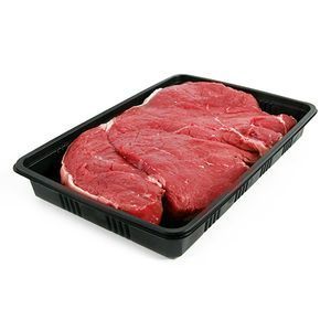 Three raw, red beef steaks arranged in a black plastic tray against a white background.