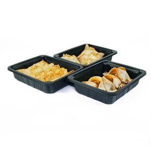 Three black plastic rectangular food trays containing various types of golden-brown fried snacks, set against a white background.