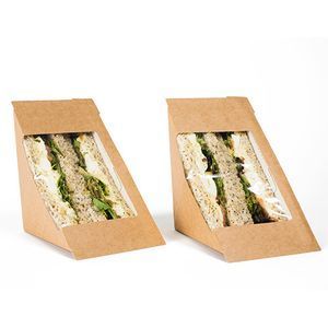 Two triangular brown paper sandwich containers with clear windows displaying sandwiches, set against a white background.