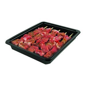 A black tray containing five raw meat skewers seasoned with spices.