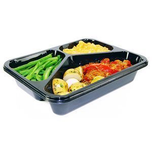 A three-compartment black plastic container holding green beans, mashed potatoes, and a chicken dish with potatoes.