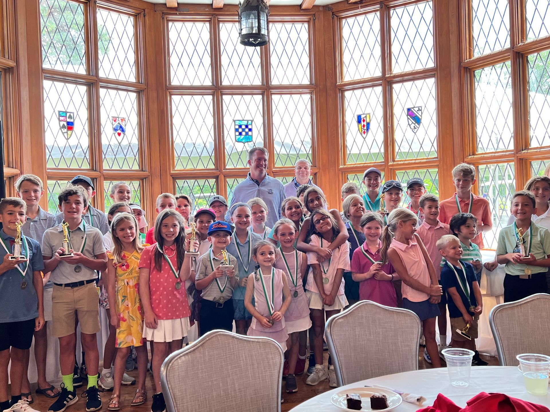 Large group of young children with trophies