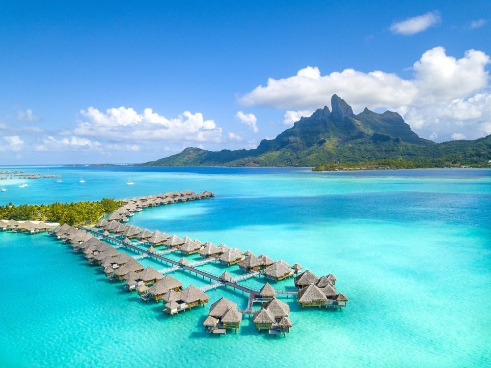 bora bora An aerial view of a resort in the middle of the ocean.