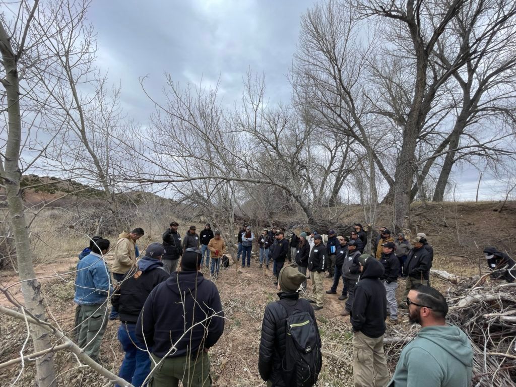 Another group photo of collaborators, this time at a riparian area