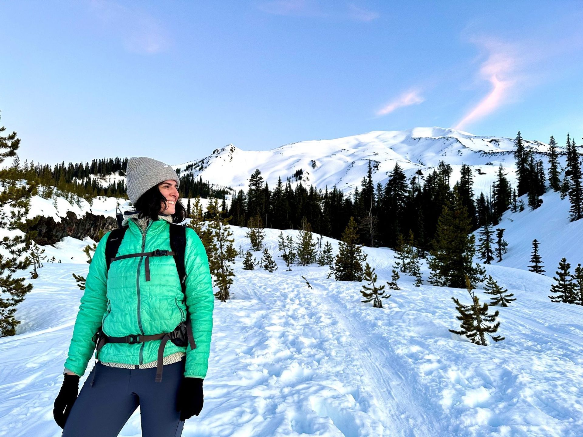 Photo of Chanda Littlefield hiking in winter