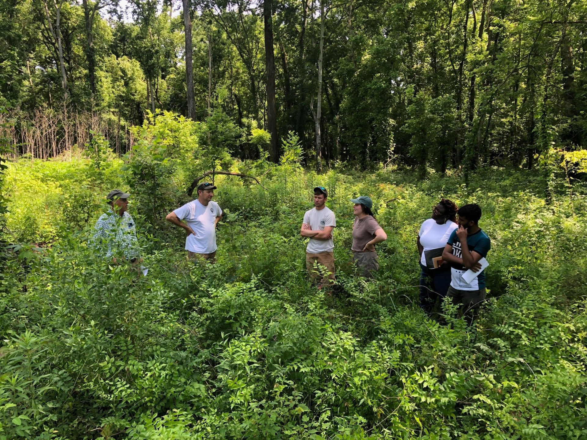 People standing in the woods at Grassy Lake WMA