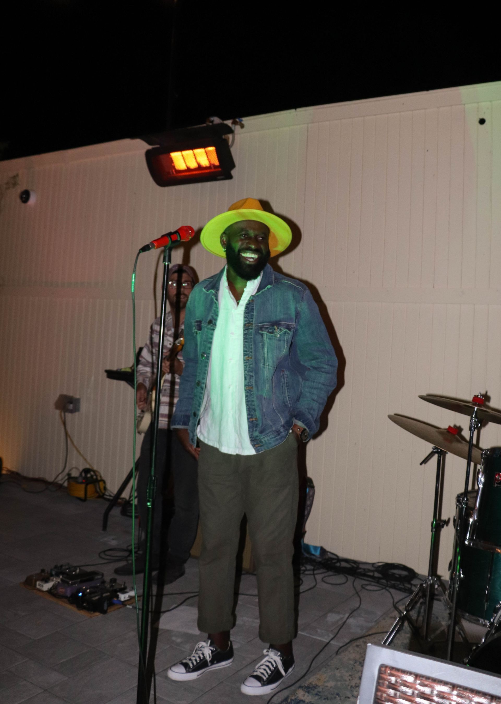 Singer Wearing Hat at Live Music Restaurant