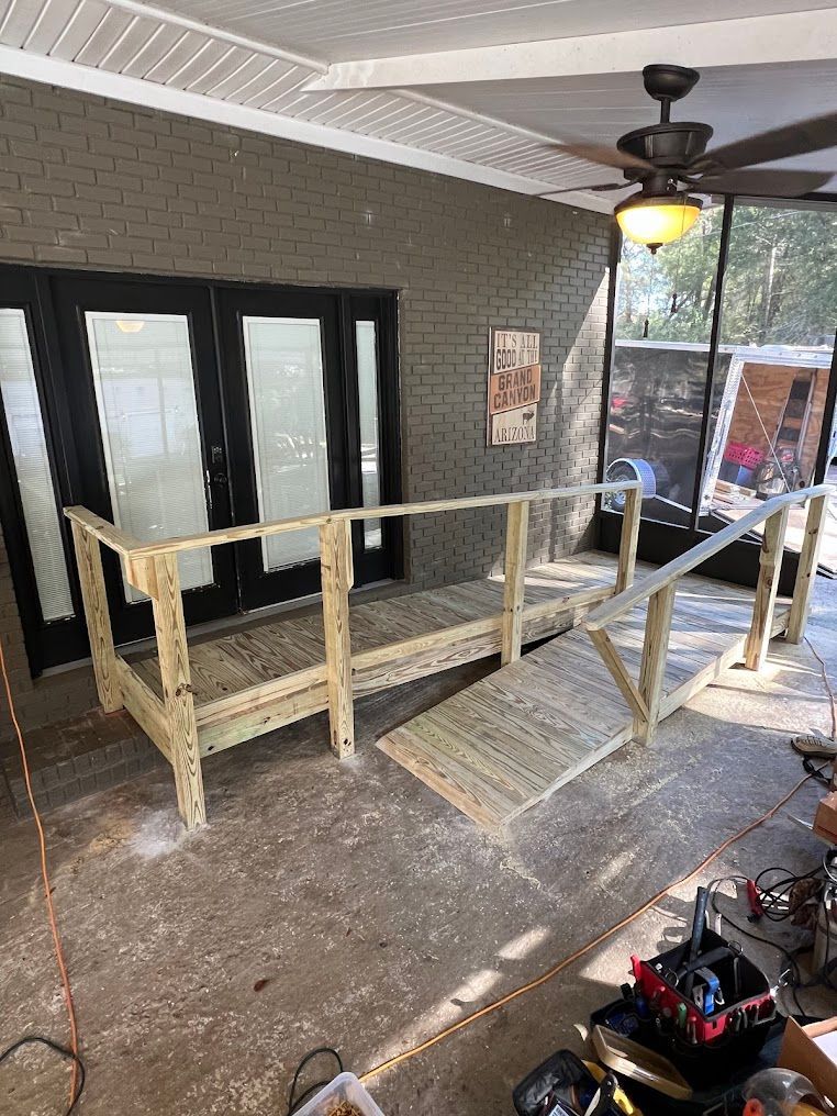 A wooden ramp is being built on a porch.