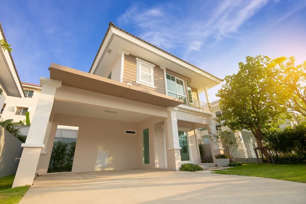 A Modern, Two-story House With a Beige Facade and Carport — Richardson Conveyancing In Tumbi Umbi, NSW