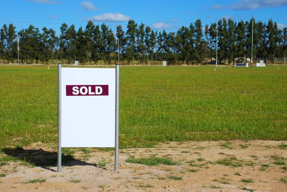A Sign Stands in the Foreground of a Large — Richardson Conveyancing In Tumbi Umbi, NSW