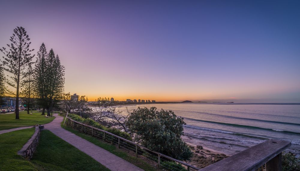 A Sunset Over A Body Of Water With A Path Leading To It — Suncoast Termite & Pest In Noosa, QLD