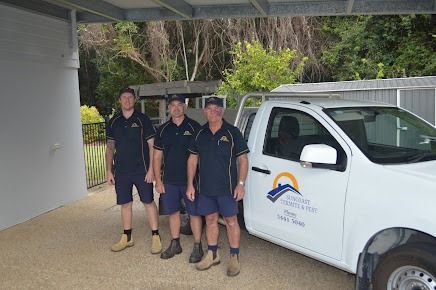 A Group Of Men Are Standing Next To A White Truck — Suncoast Termite & Pest In Nambour, QLD