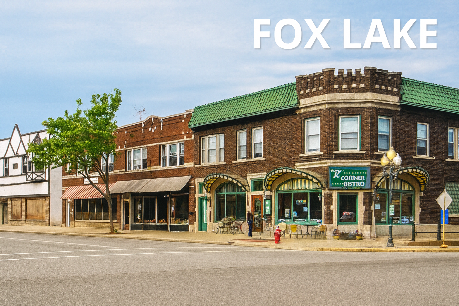 Buildings along a street in Fox Lake, IL. Brick and stucco storefronts under a cloudy sky.