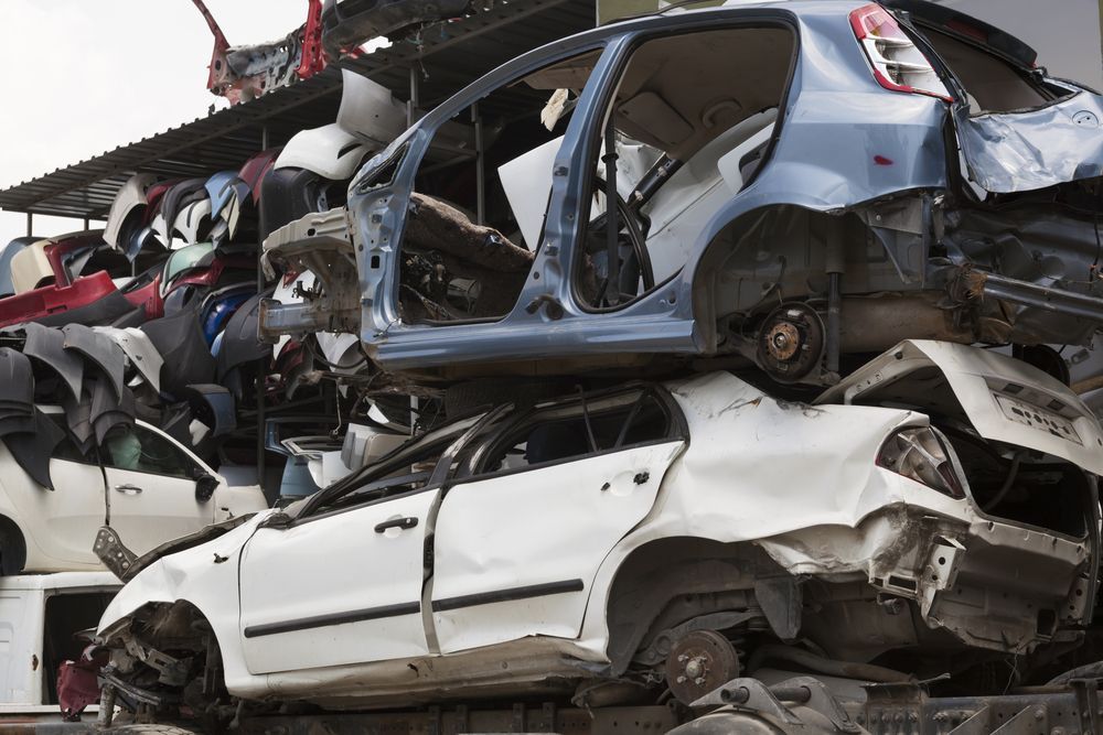 Stack of Wrecked, Salvaged Cars in a Scrap Yard — Murwillumbah Motor Wreckers in Tweed Heads, NSW