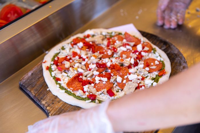Dang Brother Pizza Camp Pendleton Pesto, Chicken, Feta, Roasted Red Pepper, & Pepperoni Pizza Photo