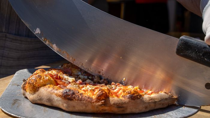 Dang Brother Pizza Camp Pendleton Slicing Pizza Photo