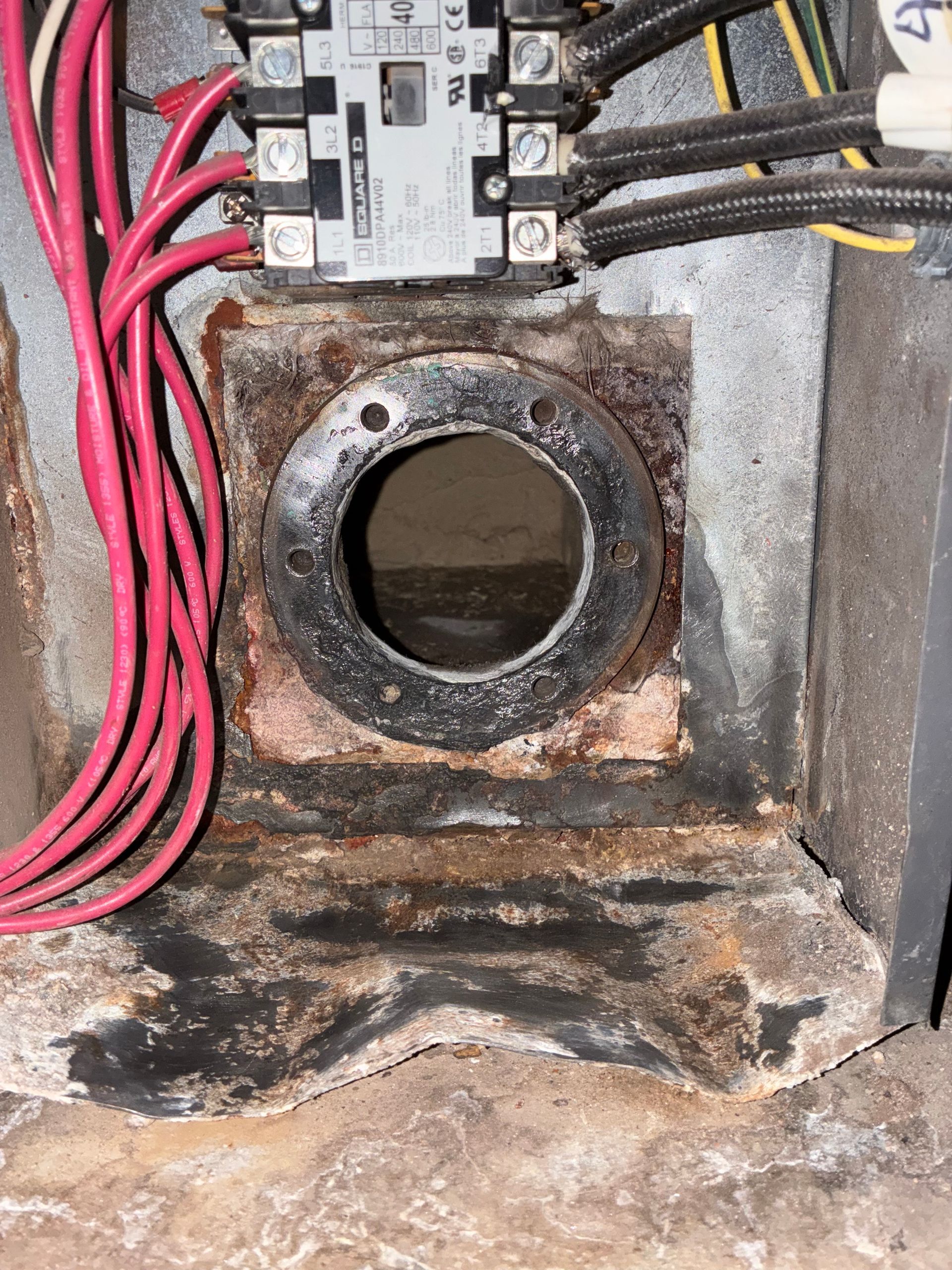A close up of a electrical box with a hole in it