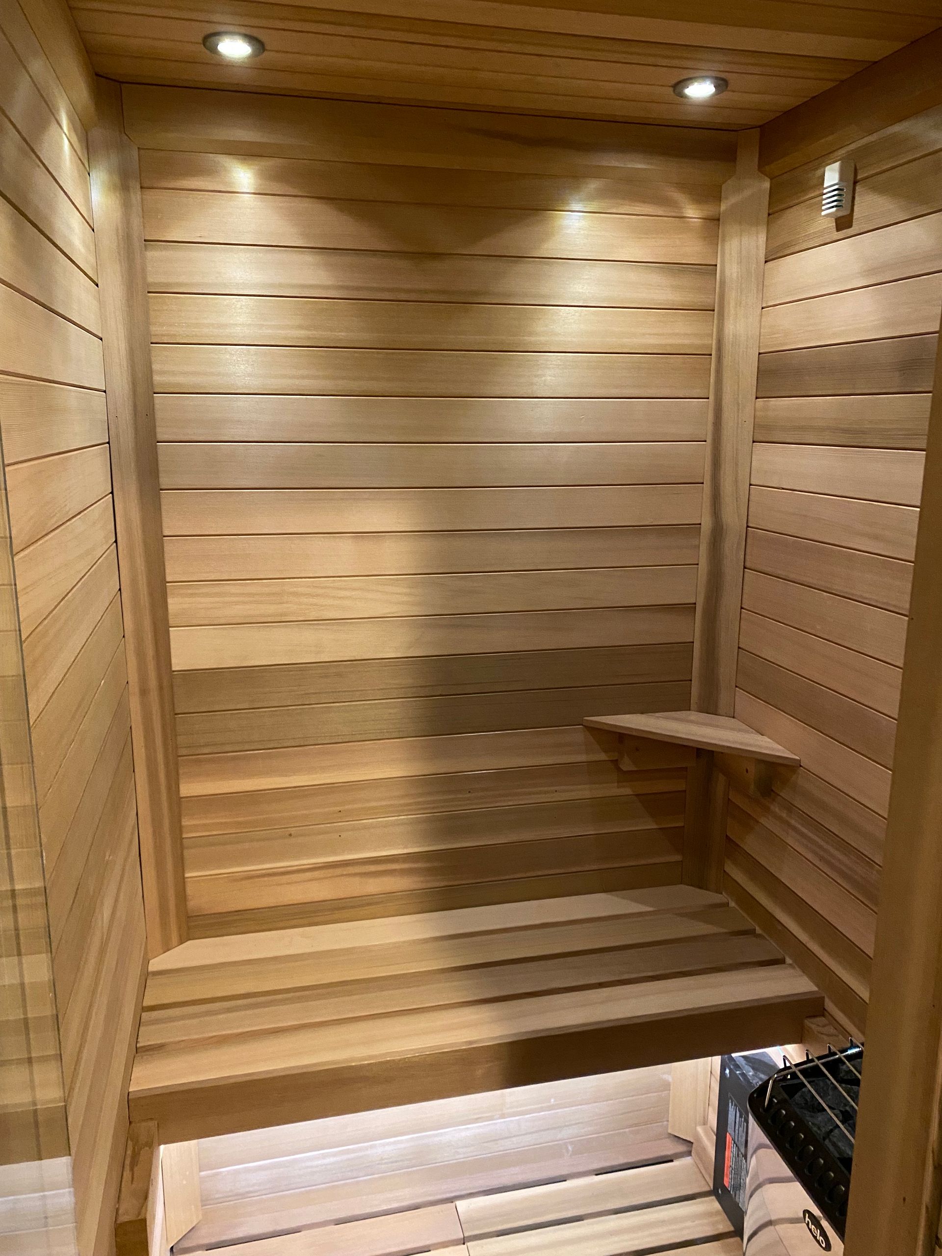 A wooden sauna is being built in a house.
