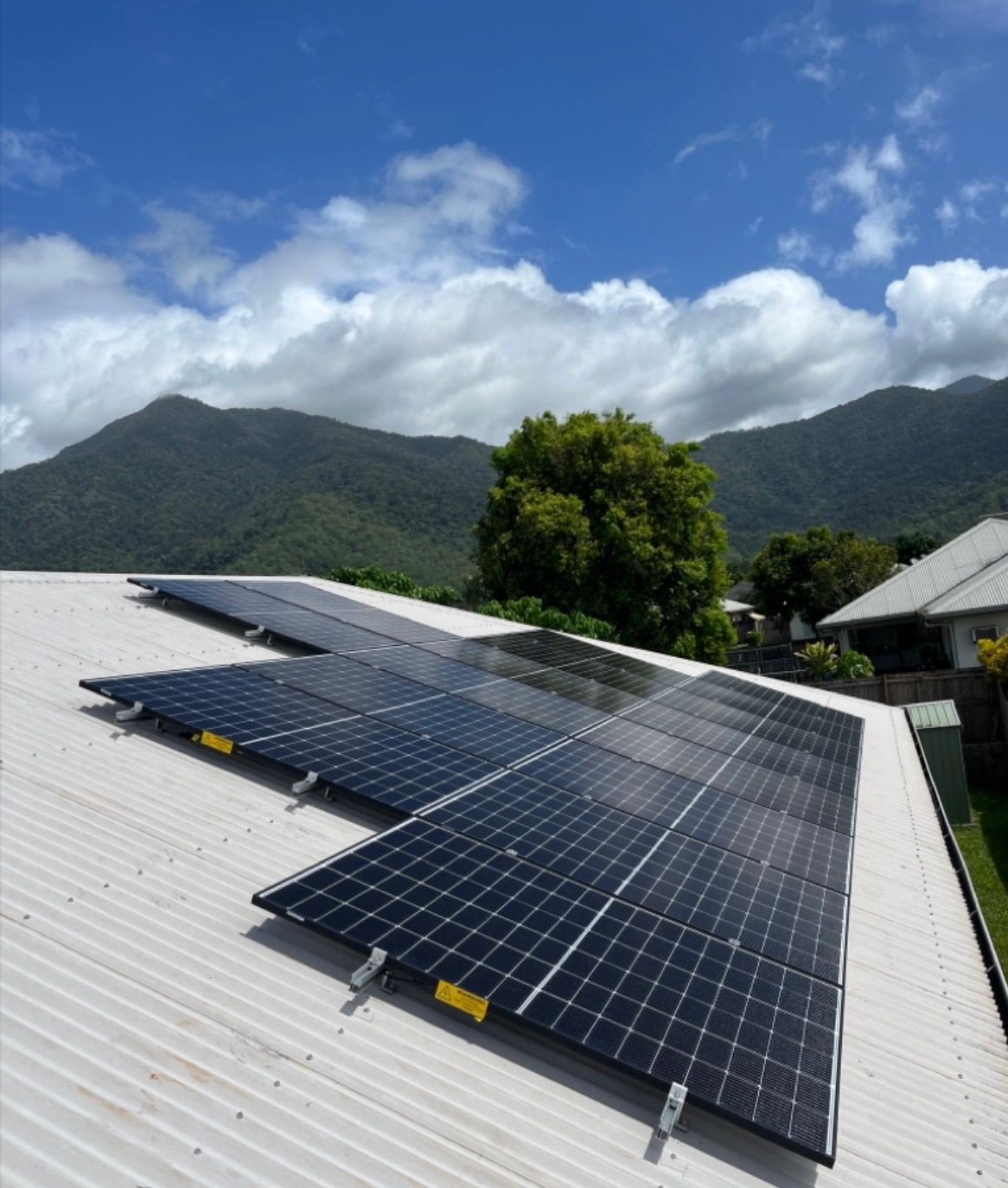 Solar Panels on a White Rooftop — Top Spark Electrical FNQ in Bayview Heights, QLD