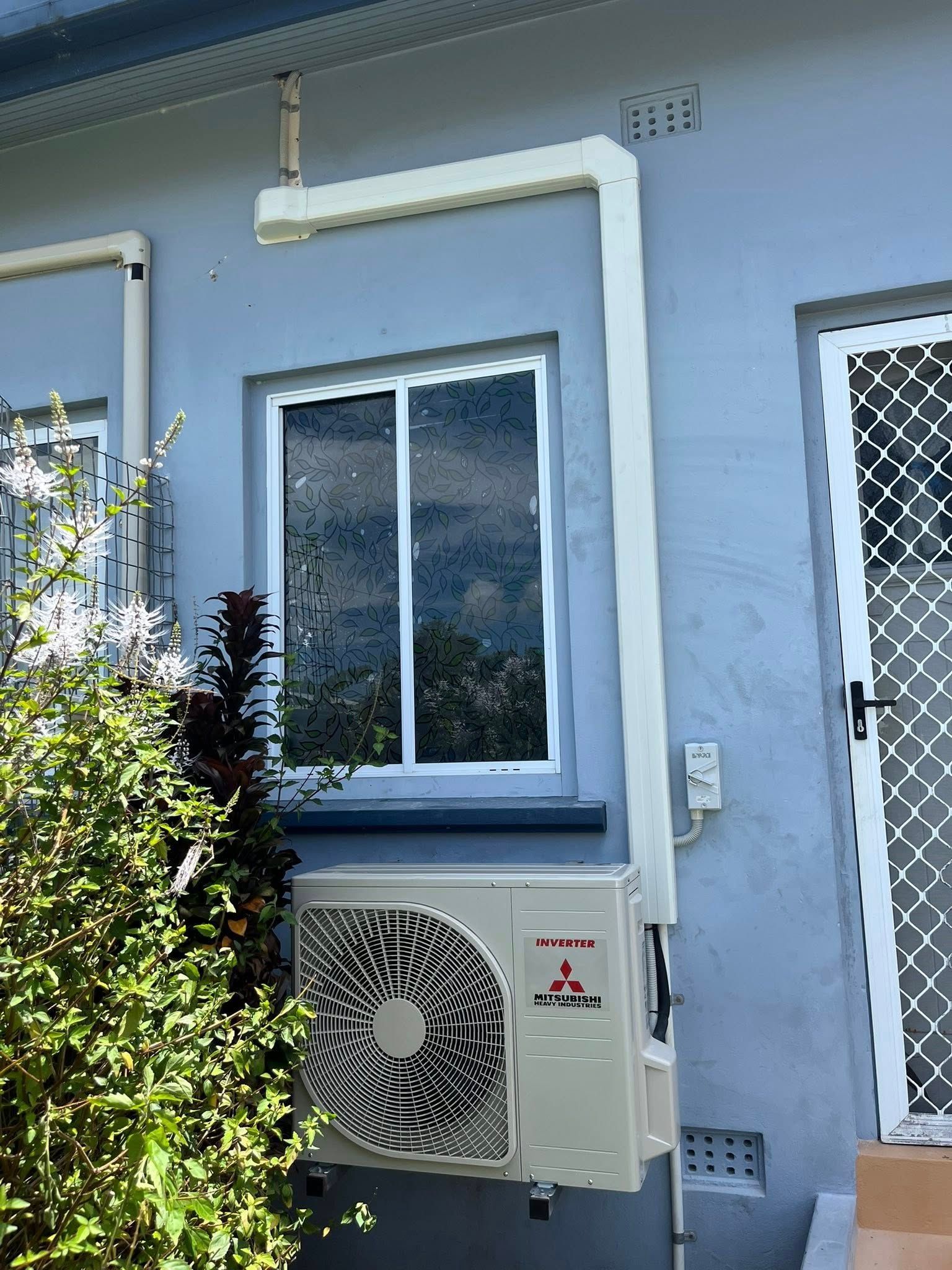 Outdoor Wall With Window and Air-conditioning Unit — Top Spark Electrical FNQ in Atherton, QLD