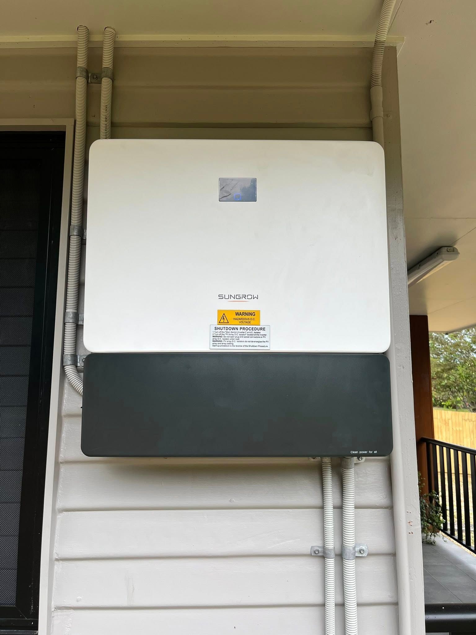 Wall-mounted White and Gray Electrical Unit With Conduit — Top Spark Electrical FNQ in Atherton, QLD