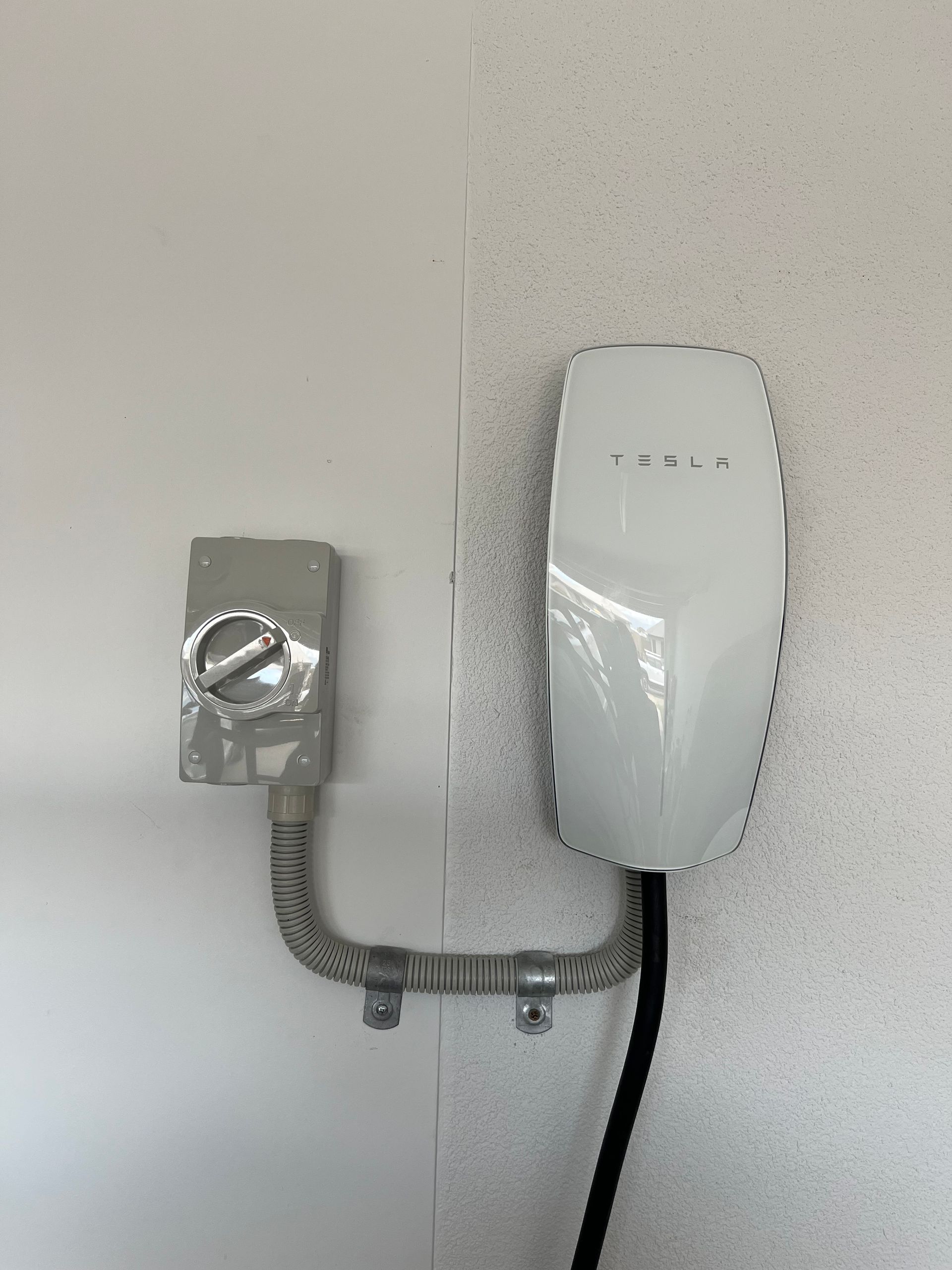Electric Vehicle Charging Stations Along a Roadside With Cars — Top Spark Electrical FNQ in Mareeba, QLD