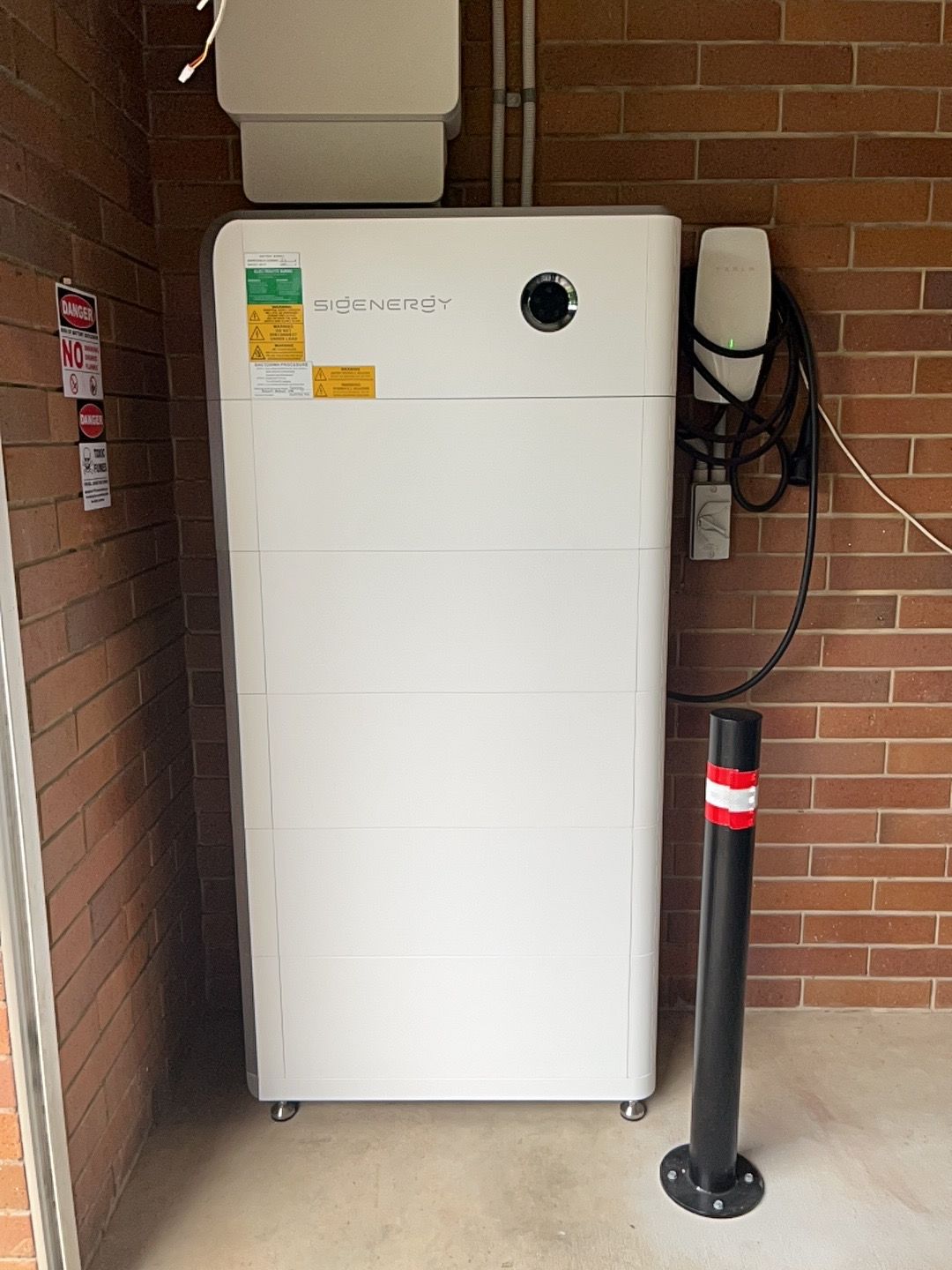 Wall-mounted White Device With a Black Cord — Top Spark Electrical FNQ in Bayview Heights, QLD