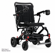 Black foldable power wheelchair with padded seat, joystick, and four wheels on a white background