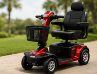 Red mobility scooter with black seat, front basket, and four wheels on a plain background