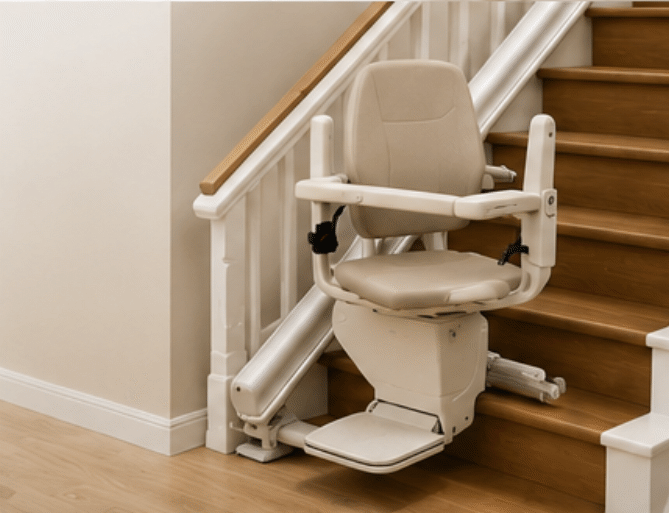 Woman seated on a stair lift beside a carpeted staircase in a home interior